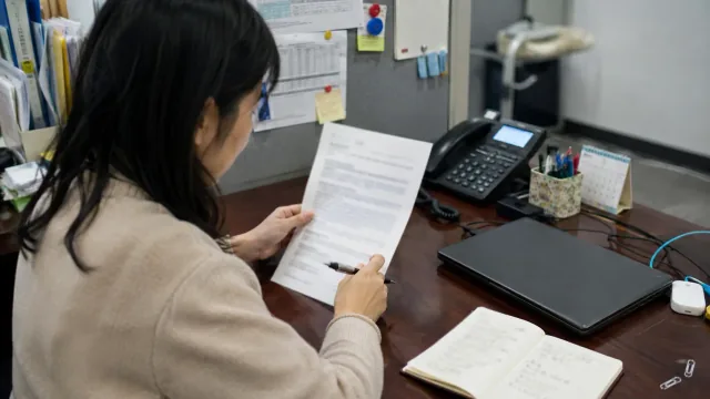 Correspondence being reviewed at a desk